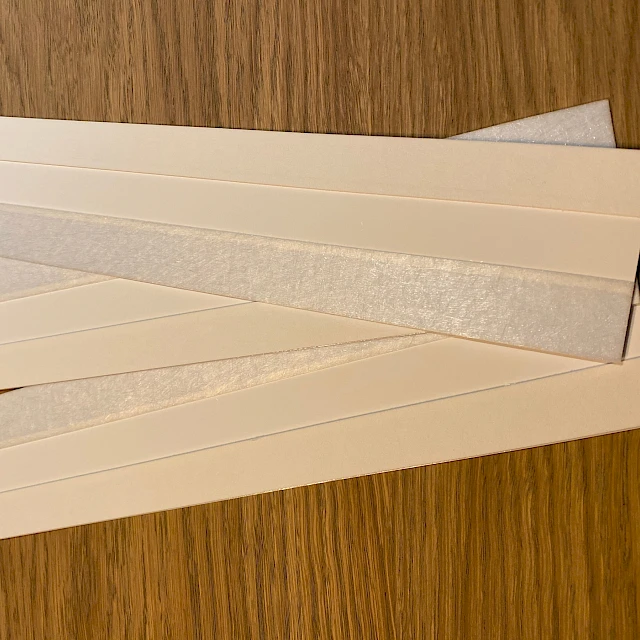 Backing card strips with pad on wood