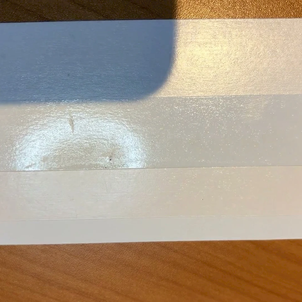 Backing card surface dent defect