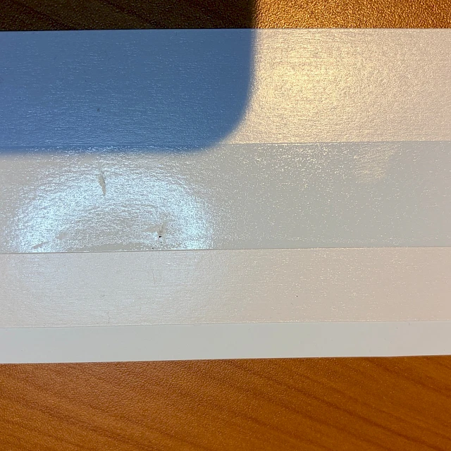 Backing card surface dent defect
