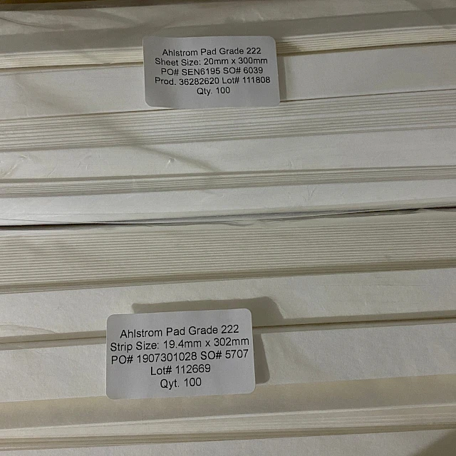 Bagged absorbent pad sheets with labels