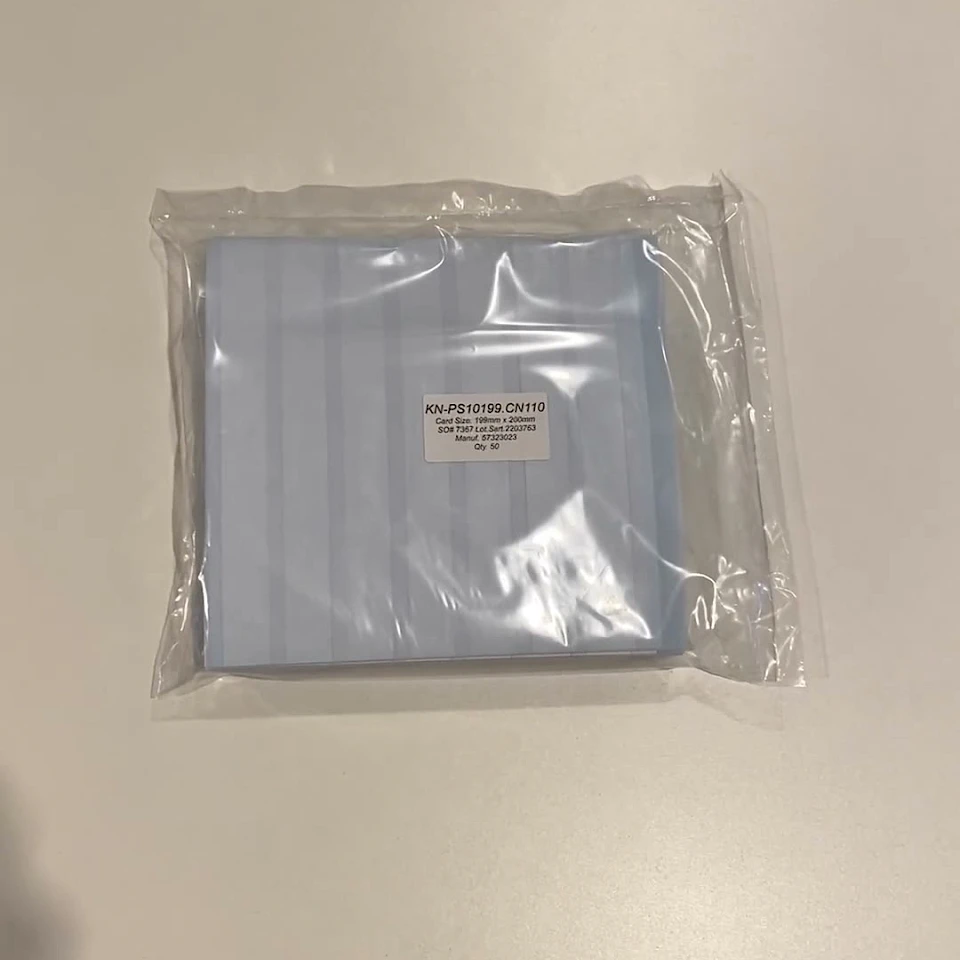 Bagged blue striped card stack on table