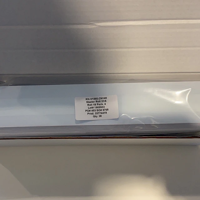 Bagged card strips in open white box