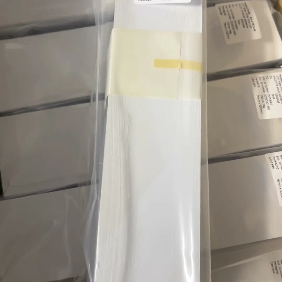 Bagged white card stack on packed bundles