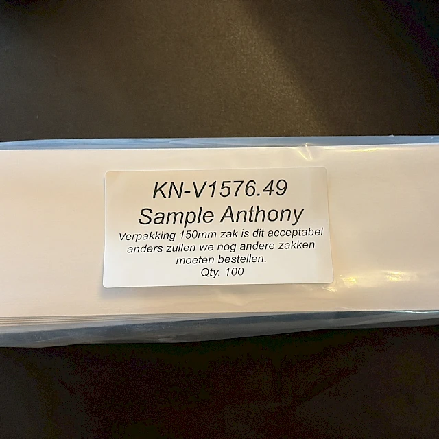 Bagged white cards with sample label