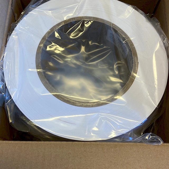 Bagged white material roll in shipping box