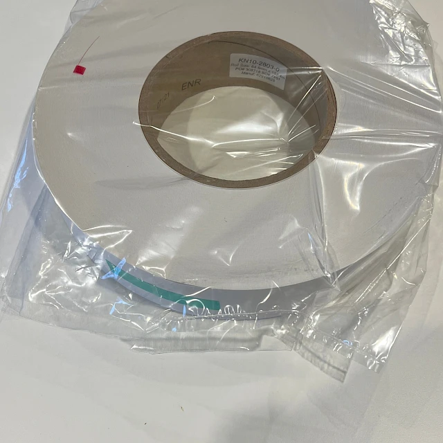 Bagged white tape roll on white table