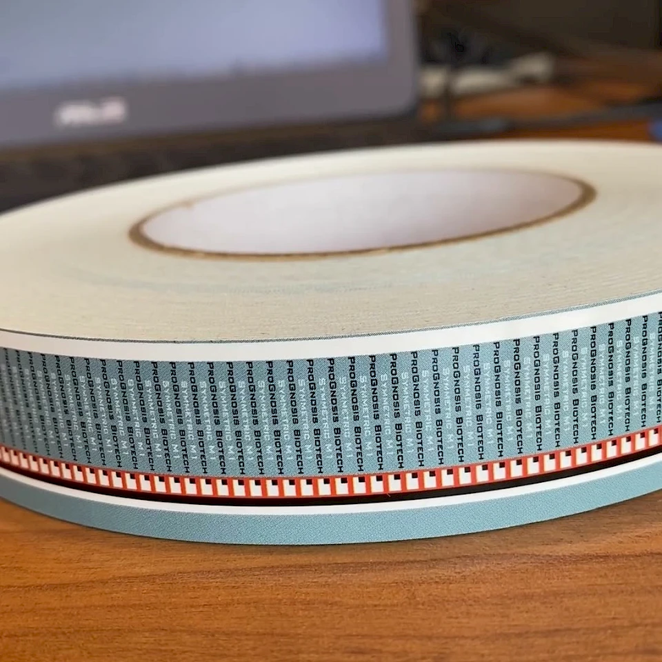 Blue and red printed tape roll on desk