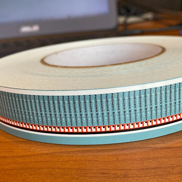 Blue and red printed tape roll on desk