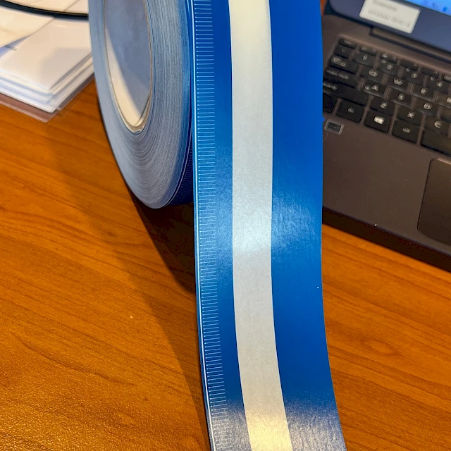 Blue and white scale tape roll with ruler