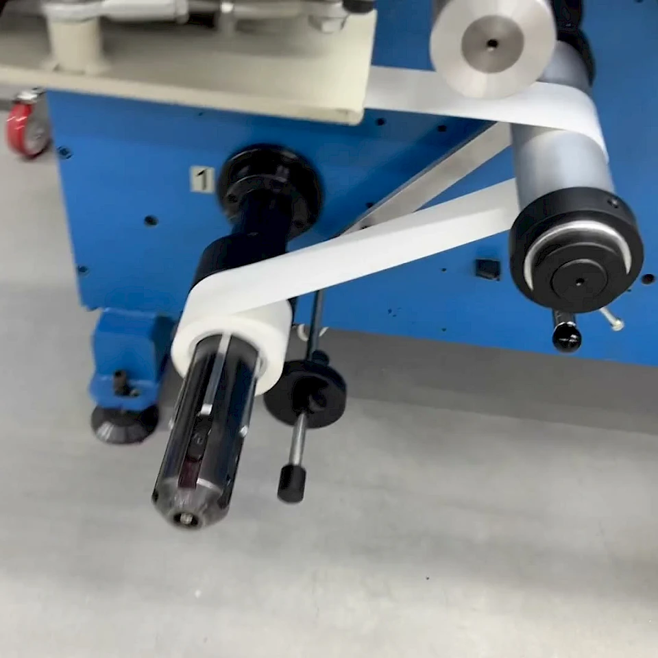 Blue converting machine rewind shaft with white web
