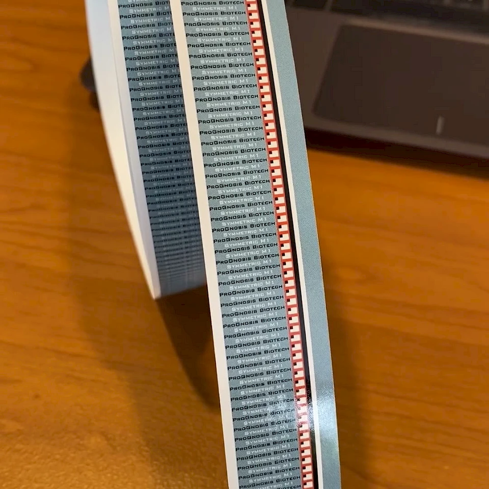 Blue grey printed tape roll standing on desk