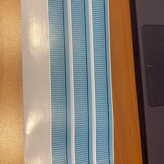 Blue printed strips on desk