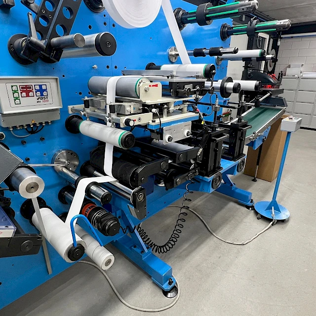 Blue rotary converting line side view in hall