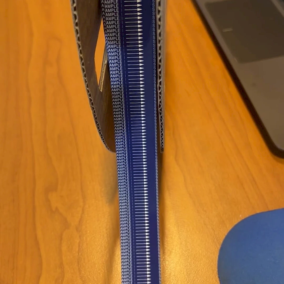 Blue sample printed tape roll on desk