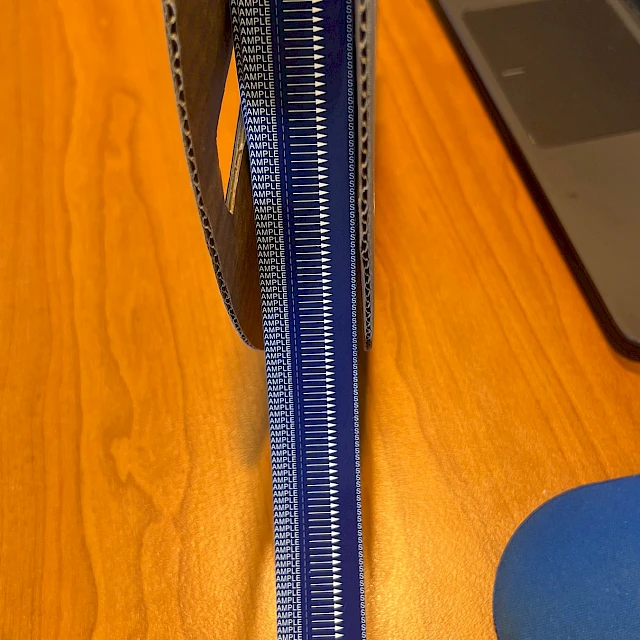 Blue sample printed tape roll on desk