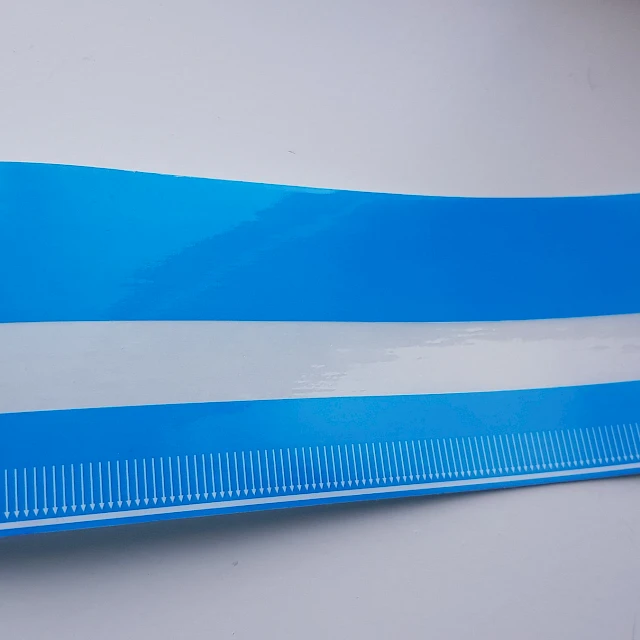 Blue striped cover tape closeup