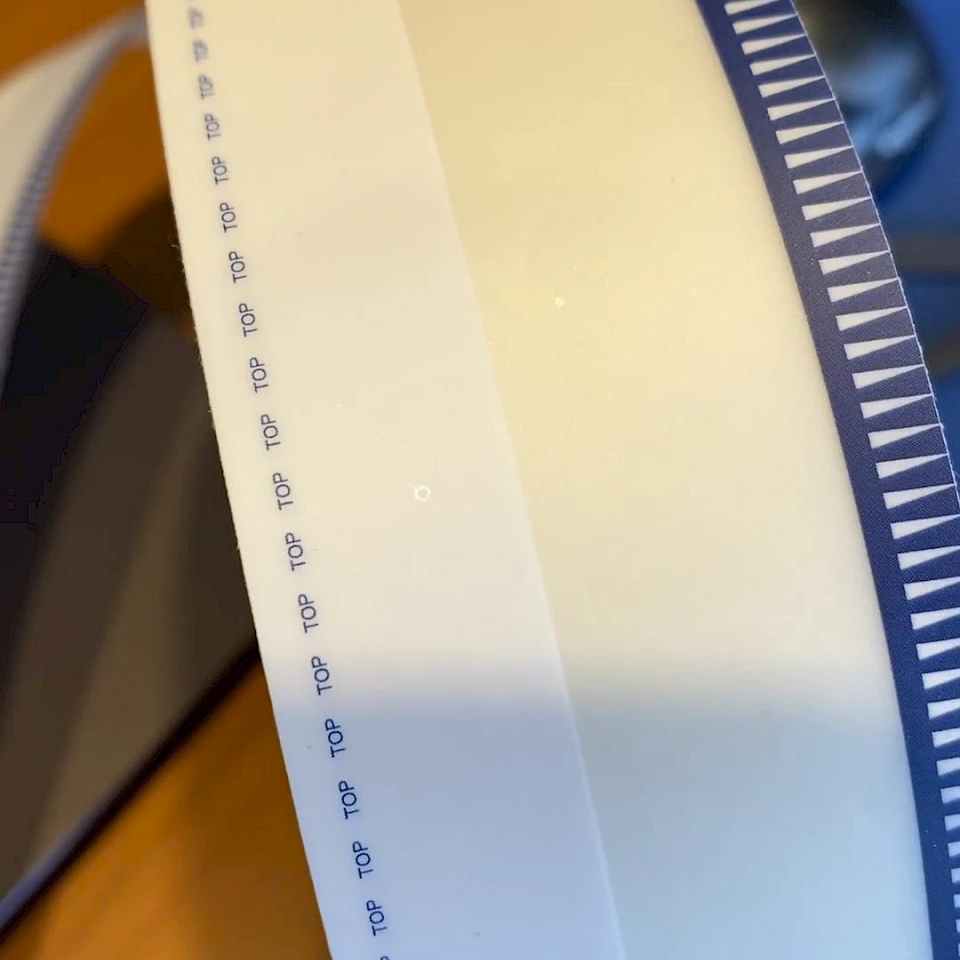 Blue teeth printed tape roll closeup