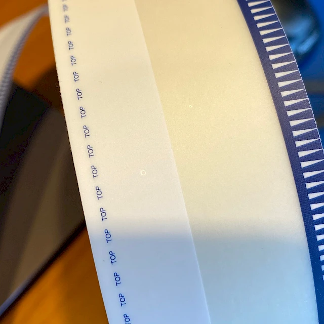 Blue teeth printed tape roll closeup
