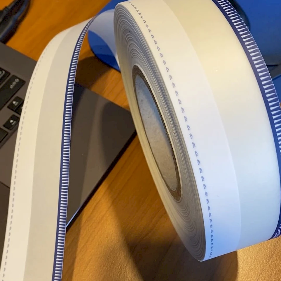 Blue teeth printed tape roll on desk