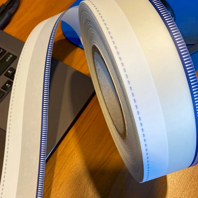Blue teeth printed tape roll on desk