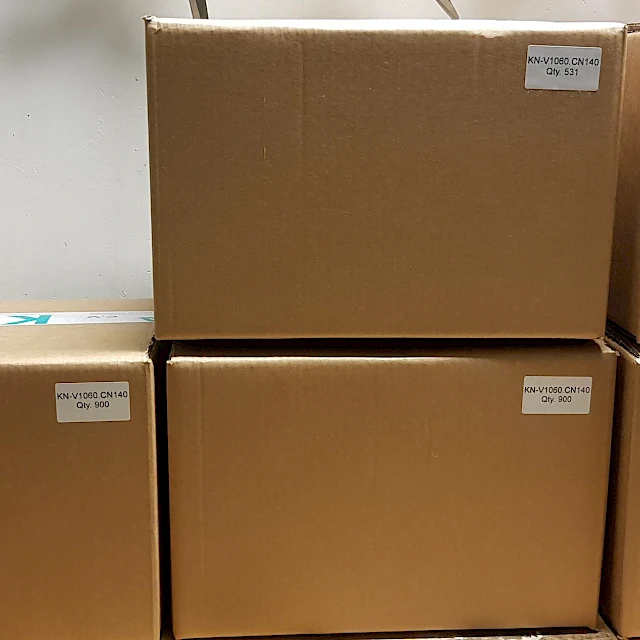 Brown shipping cartons stacked with labels