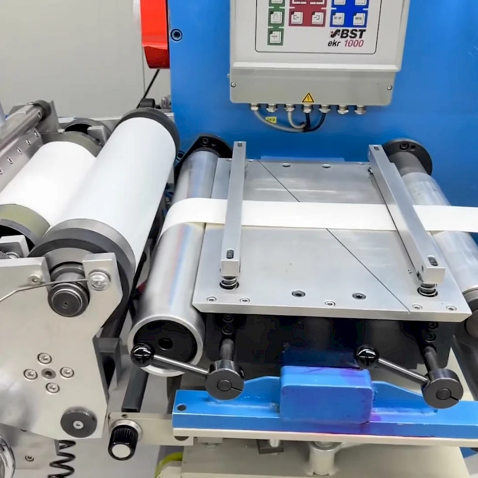 Bst web guide and laminating rollers on blue machine
