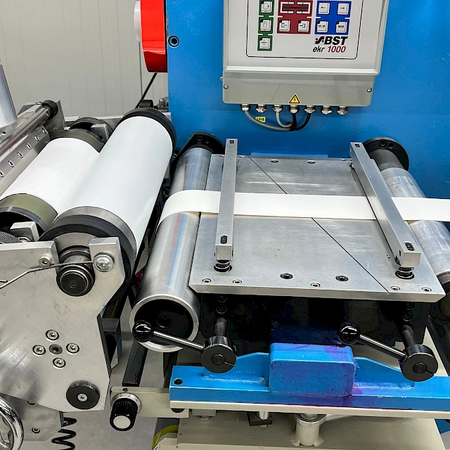 Bst web guide and laminating rollers on blue machine