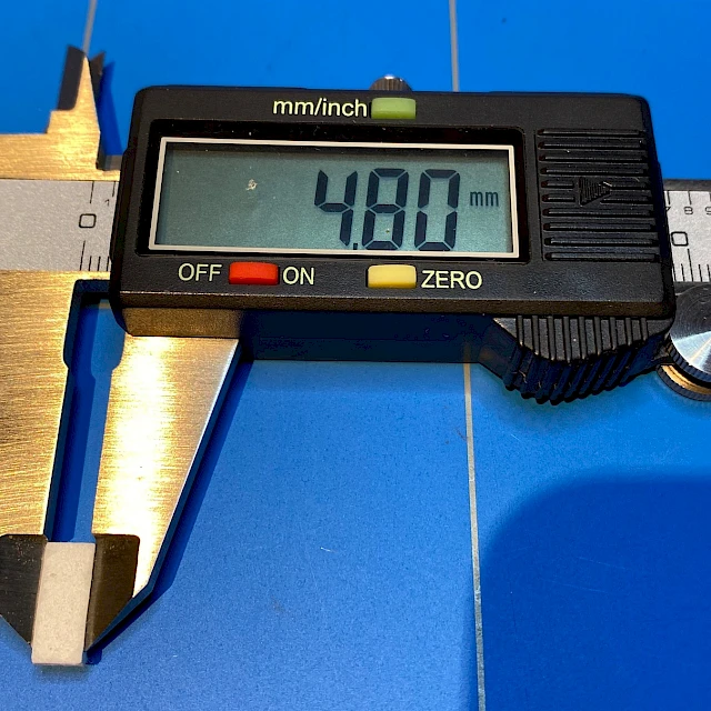 Caliper measuring pad thickness