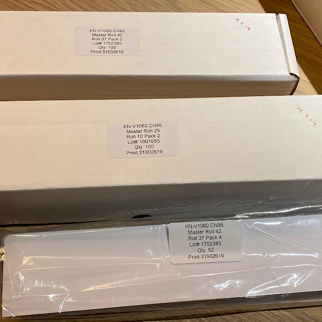 Card boxes with labels on table