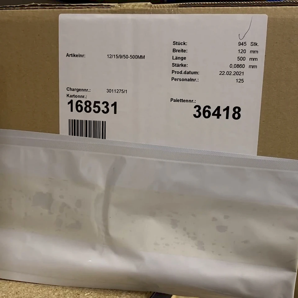 Cardboard box with stock label and bag