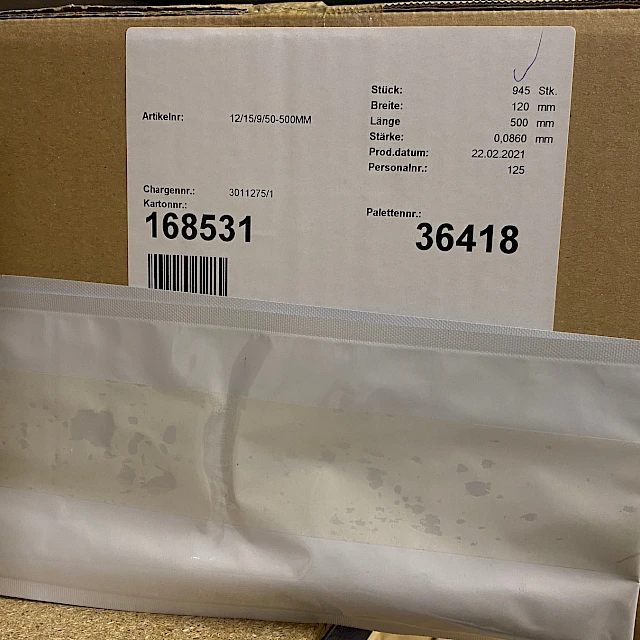Cardboard box with stock label and bag
