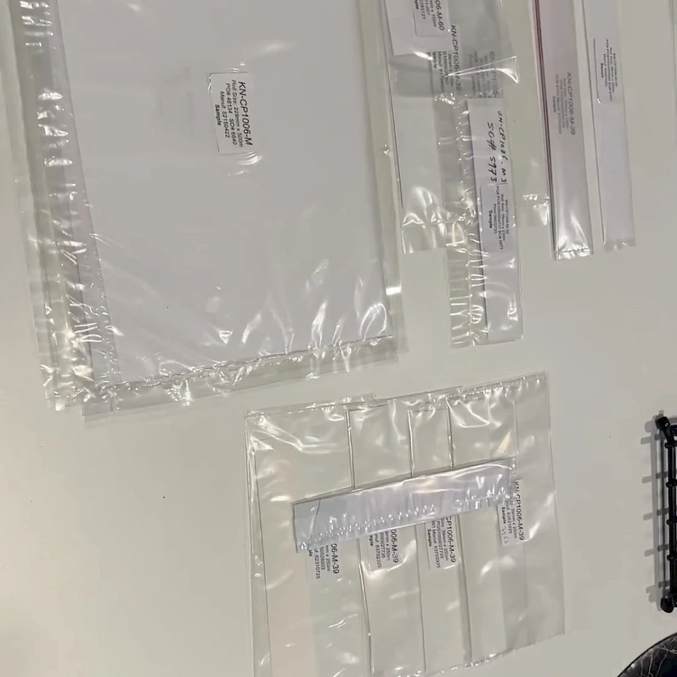 Clear bagged film samples laid on white table