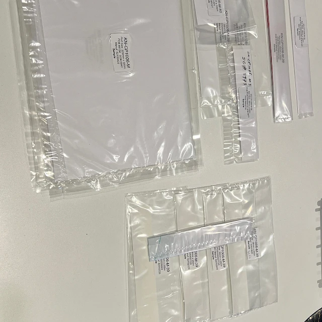 Clear bagged film samples laid on white table