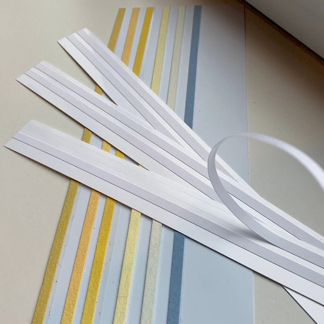 Colored laminate strips fanned