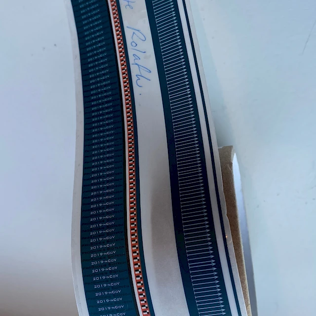 Dark green printed tape roll