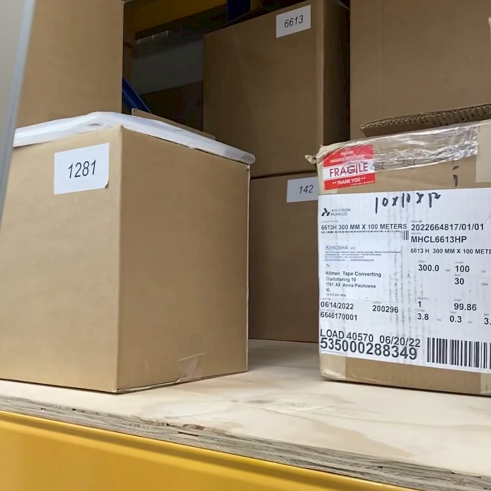 Fragile labelled supplier carton on rack shelf