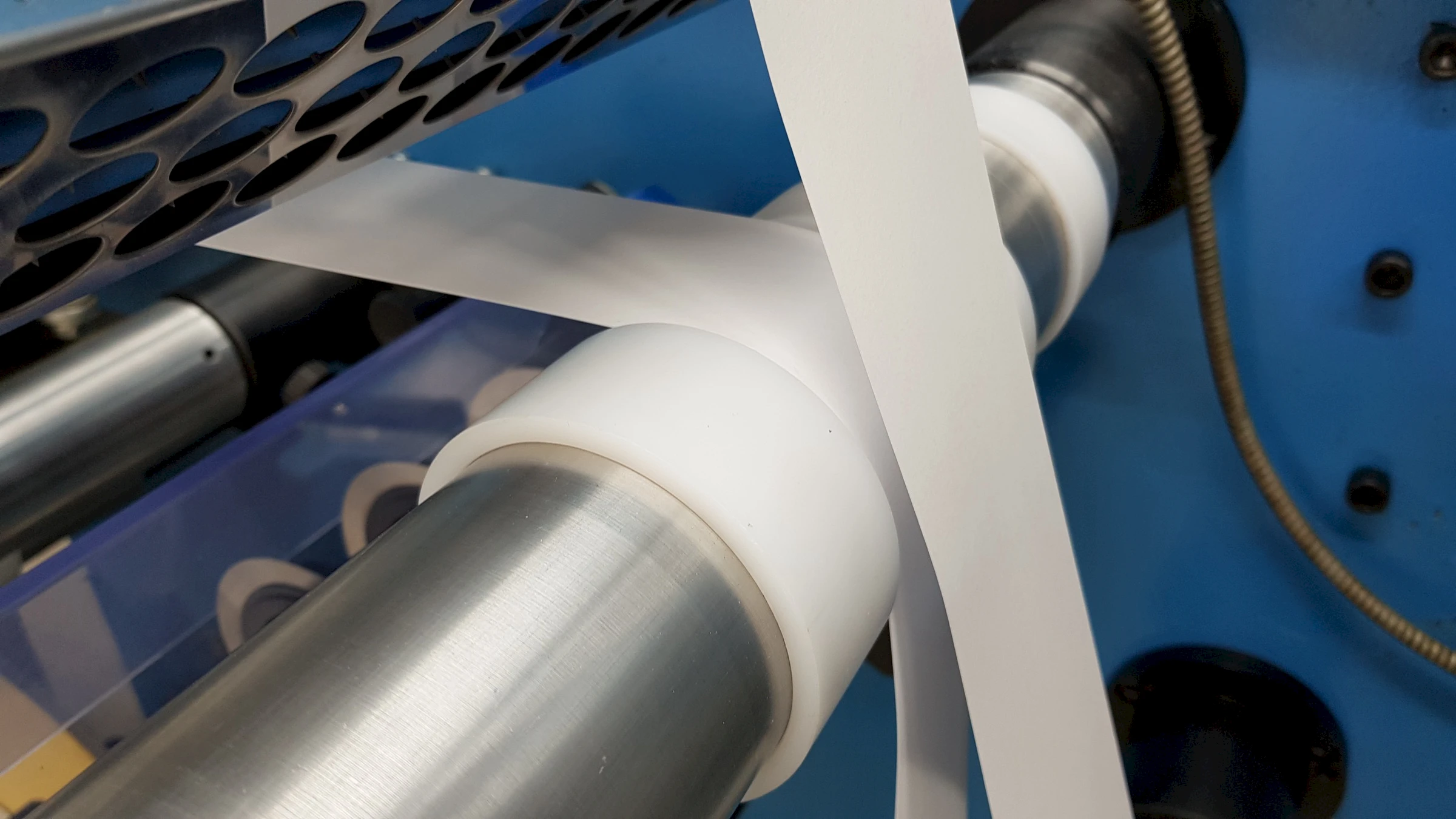 White web on machine rollers