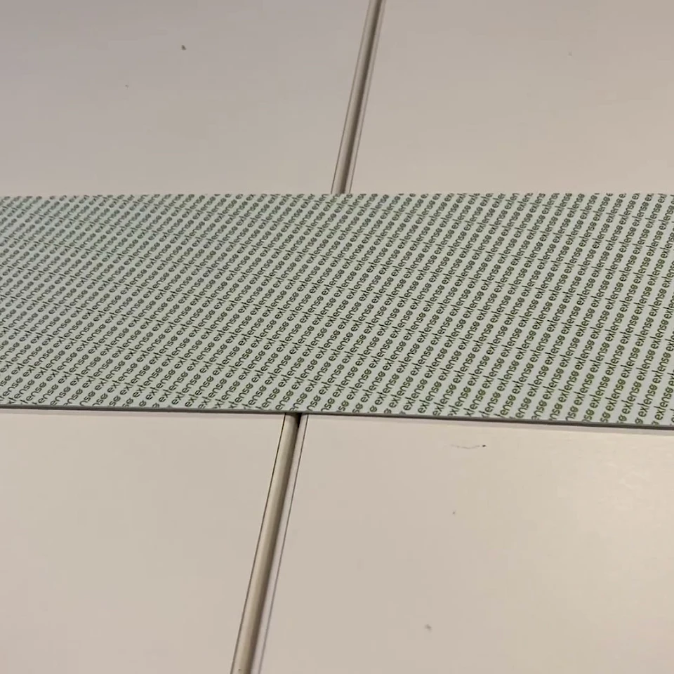 Green dot printed tape close up on table