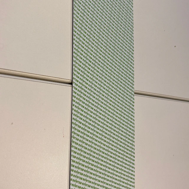 Green dot printed tape close up on table
