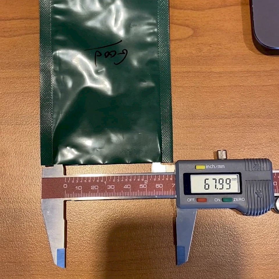 Green foil pouch width check with caliper