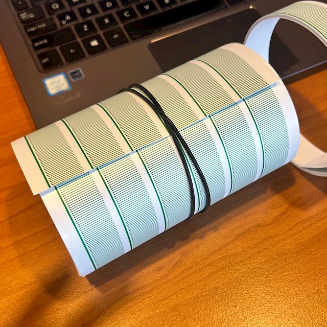 Green line printed sheets rolled with rubber band