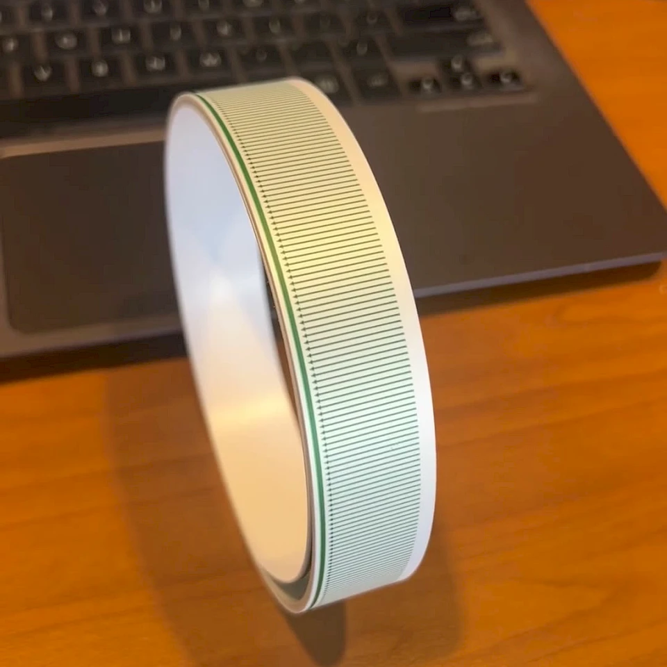 Green line printed tape roll on desk