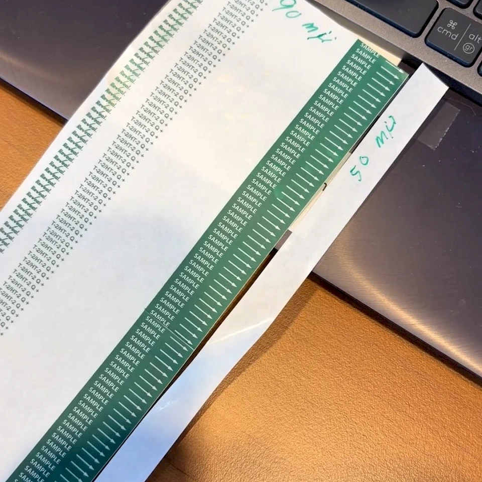 Green scale printed strips on laptop