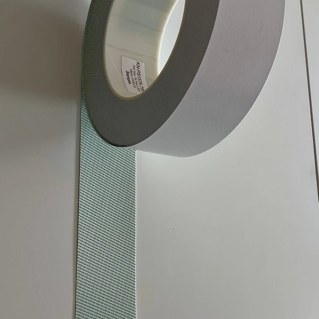Grey tape roll with mesh liner close
