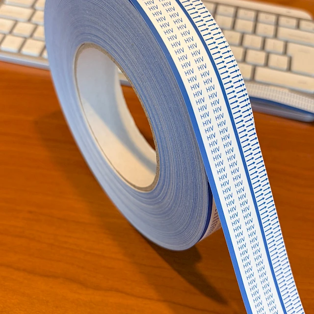 Hiv arrow printed tape roll desk