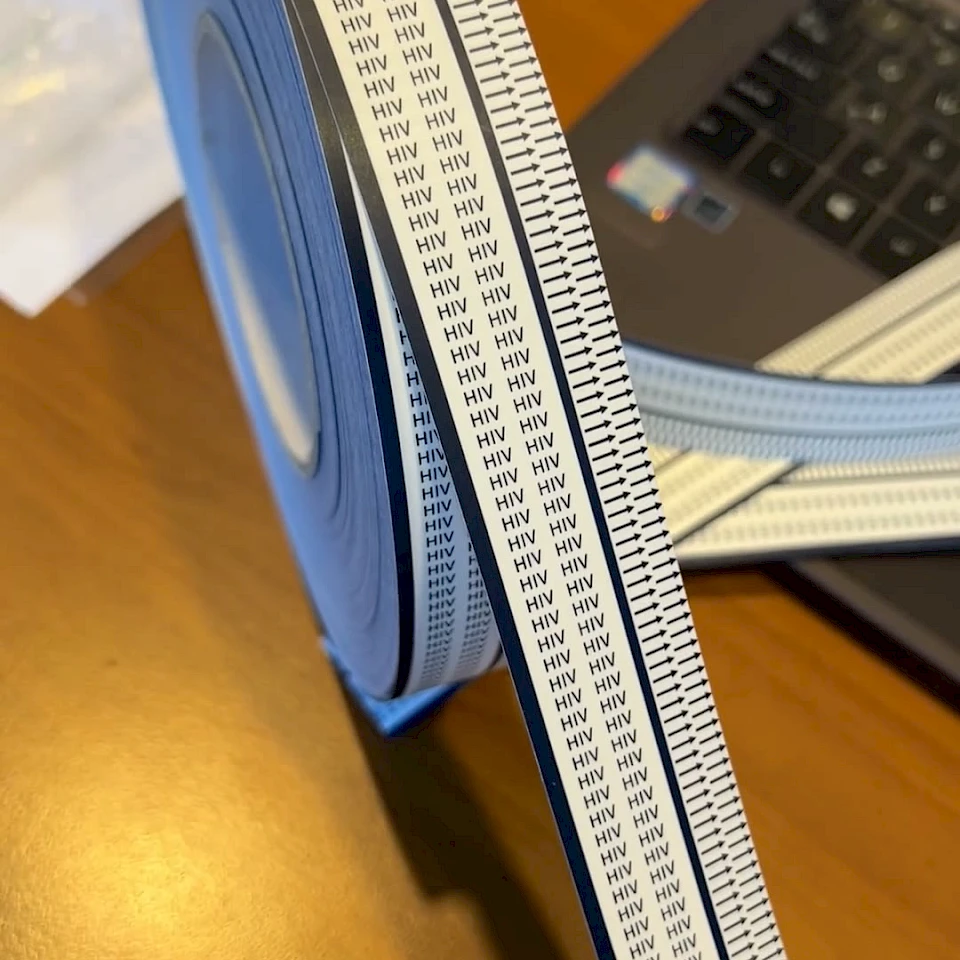 Hiv printed cover tape roll on desk