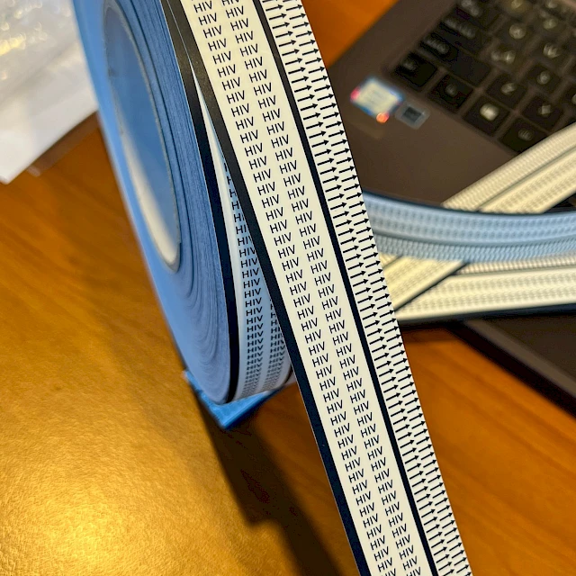 Hiv printed cover tape roll on desk