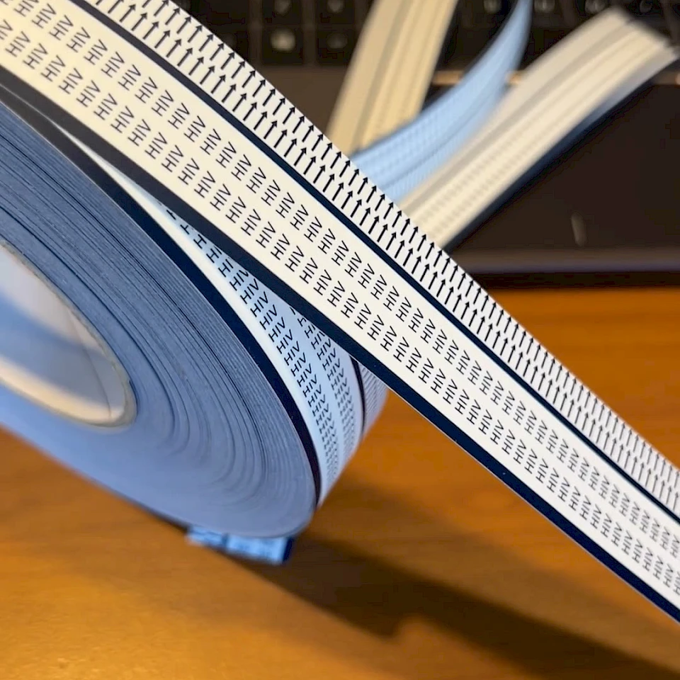 Hiv printed tape roll unwound by laptop