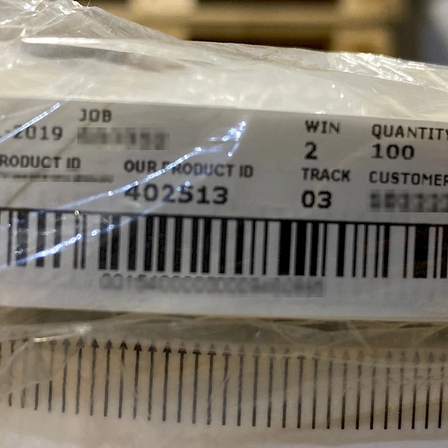 Job label on wrapped printed roll