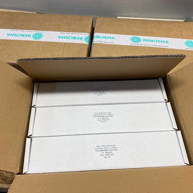 Kenosha taped cartons with white product boxes
